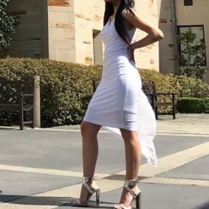 Bcbgmaxazria white mini dress with a long ruffle